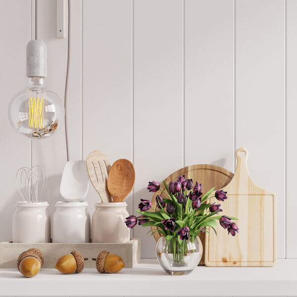 kitchen interior with kitchen standing on white shelf.